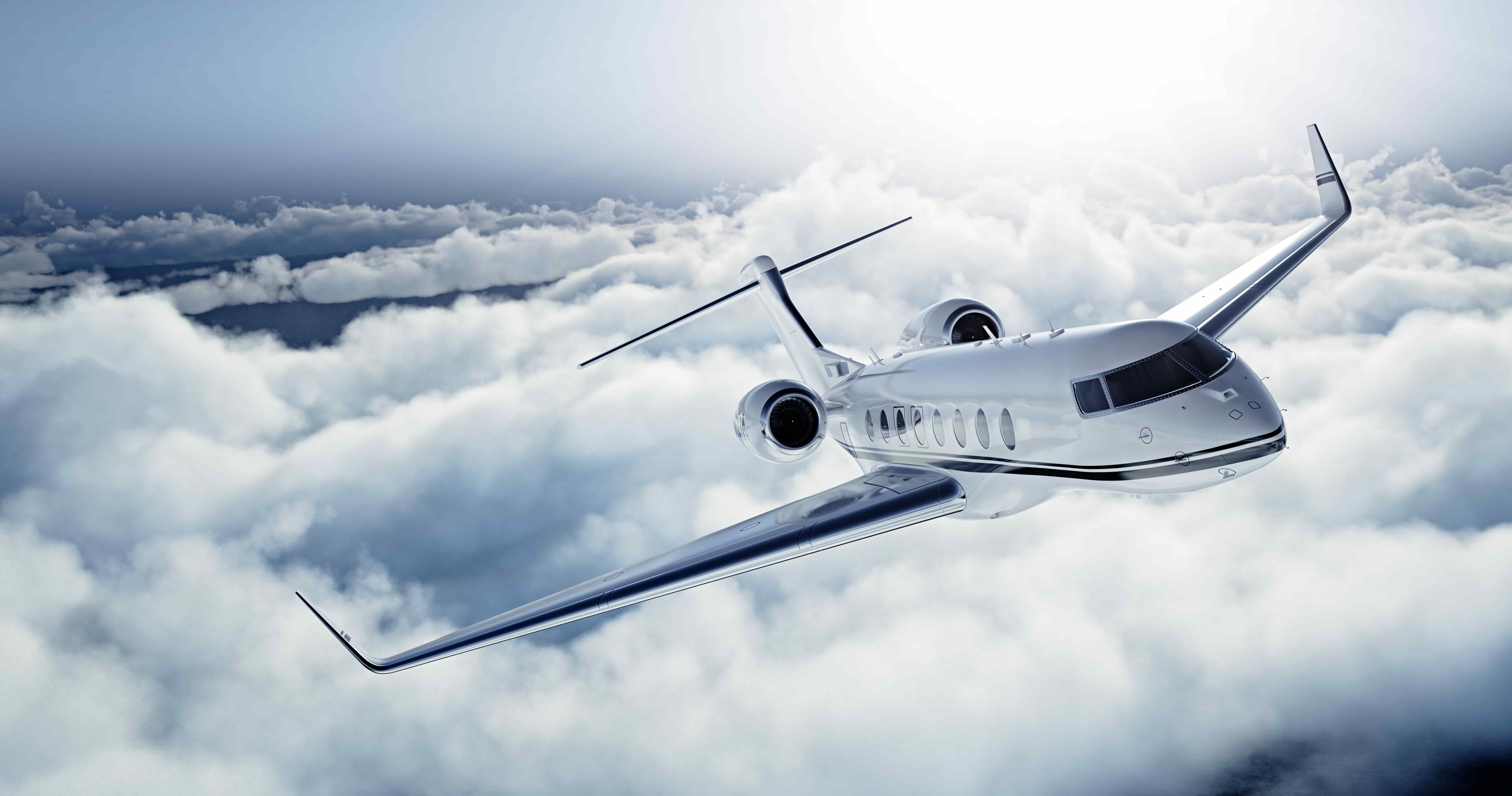 Business jet charter flying in the clouds